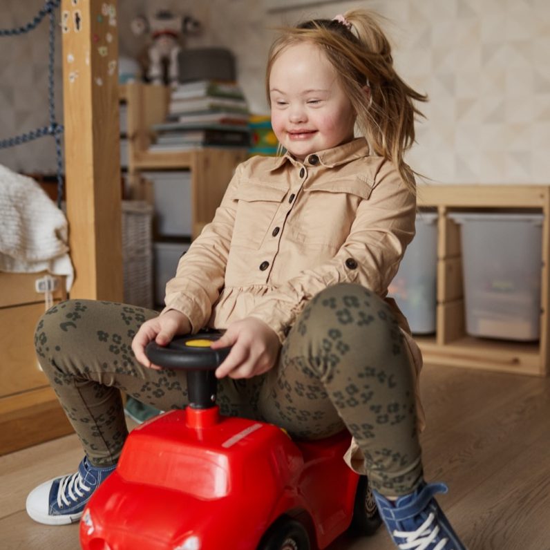 cute-girl-with-downs-syndrome-playing-at-home-2025-04-14-22-00-41-utc Large