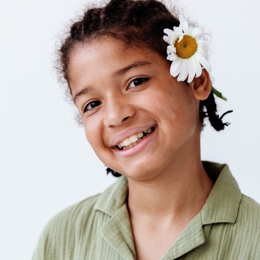 young-african-american-boy-with-daisy-in-his-hair-2025-03-11-11-58-36-utc Large